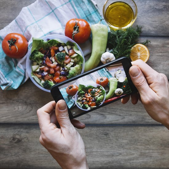 Crop hands taking s salad