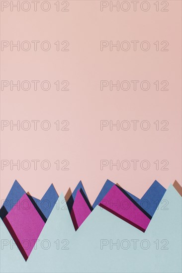 Flat lay colorful paper pink background