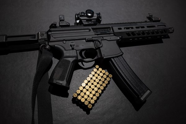 Modern Elegant Assault Rifle and Bullet on Grey Background in Switzerland