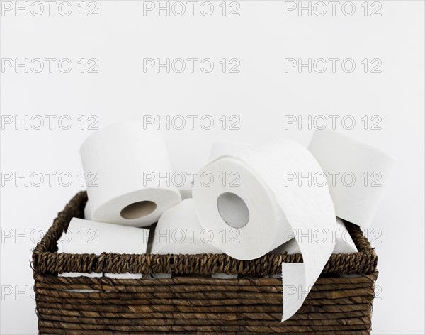 Backet with toilet paper rolls