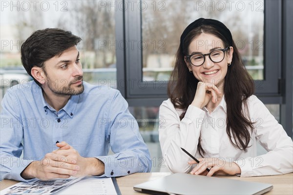 Front view man woman attending job interview