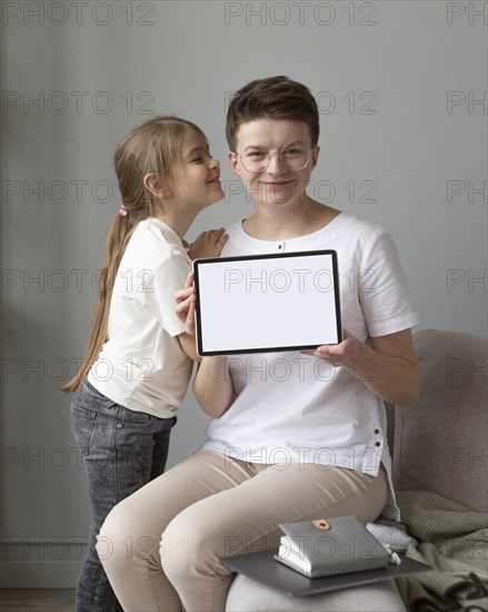 Medium shot parent kid with tablet
