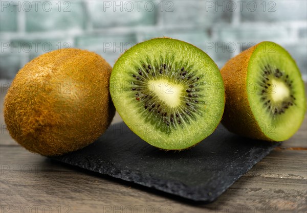 Fresh kiwis sliced on a plate