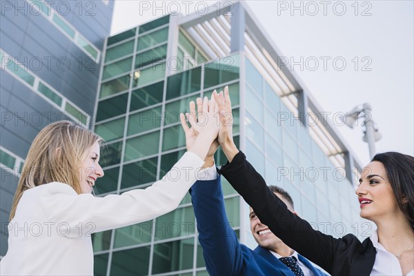 Business team making high five