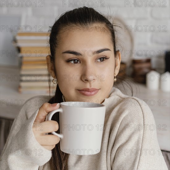 Close up smiley woman holding cup