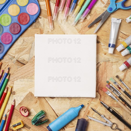 Colourful wooden desk with stationery items