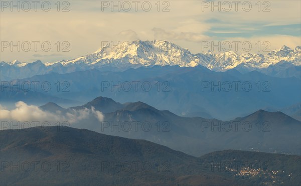 Aerial View over a Beautiful Mountainscape and And Snow Capped Monte Rosa and Mountain Peak Matterhorn and with Floating Clouds in a Sunny Day in Ticino