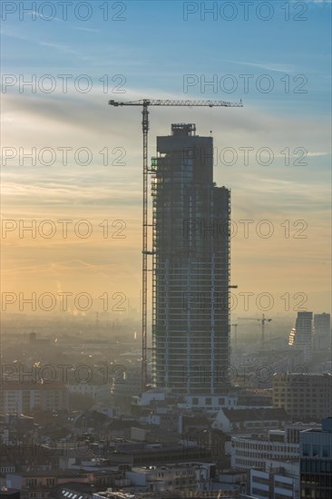 Sunset between skyscrapers. Cityscape with modern office buildings and streets. Insurance companies and banks as a cityscape in Frankfurt am Main