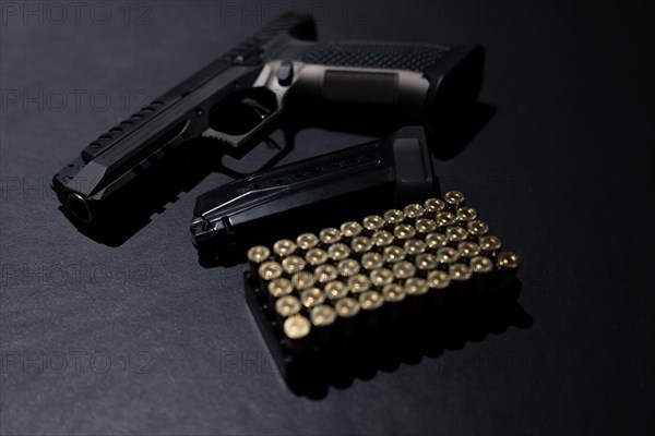 Modern Elegant Handgun and Bullet on Grey Background in Switzerland