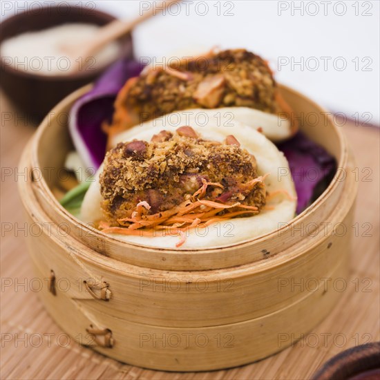 Close up traditional food gua bao bamboo steamer