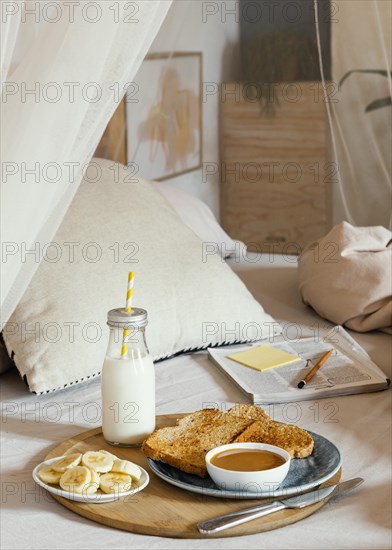 Delicious breakfast bed high angle