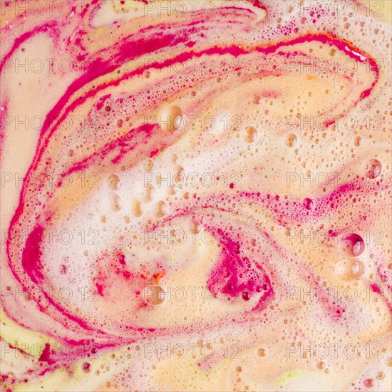 Dissolve red yellow bath bomb background