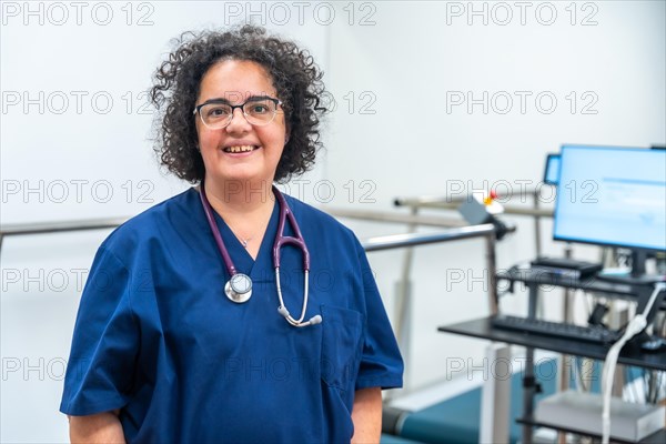 Portrait of a smiling mature cardiologist standing proud with arms crossed in the hospital