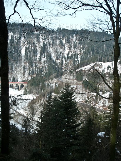 View from the Bister waterfall to the hairpin bends of the main road through the Hoellental valley and to the stone arch railway bridge over the Ravenna gorge