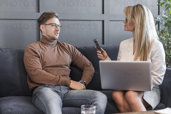 Journalist taking interview office