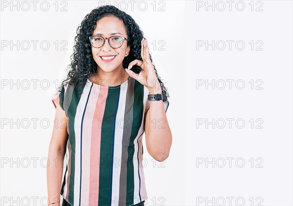 Positive afro woman showing ok gesture isolated. Smiling afro girl gesturing ok approved isolated