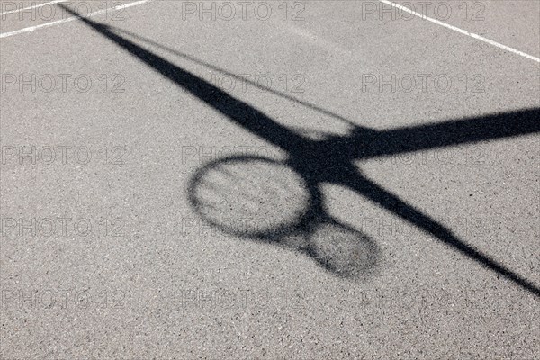 Shadow of a Basketball Hoop Against the Ground with Sunlight in Switzerland