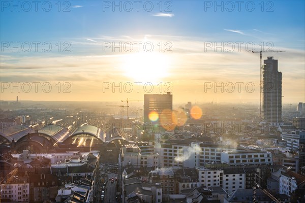 Sunset between skyscrapers. Cityscape with modern office buildings and streets. Insurance companies and banks as a cityscape in Frankfurt am Main