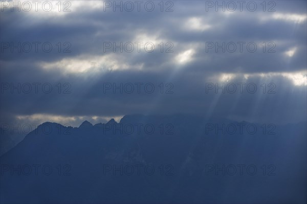 Rays of sunshine break through the clouds on Lake Geneva in Vevey