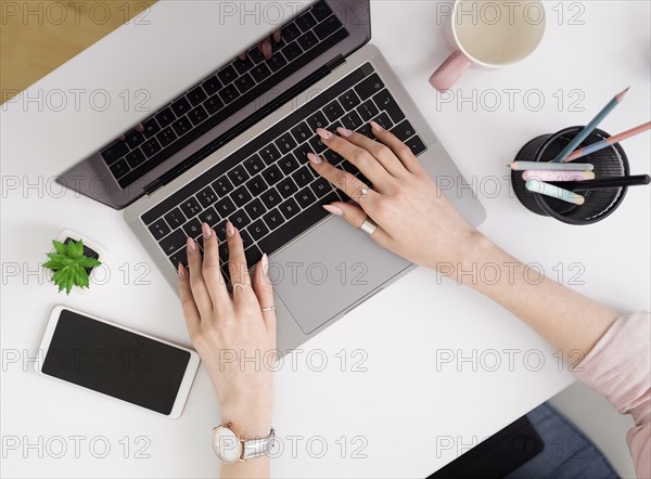 Flat lay woman working laptop