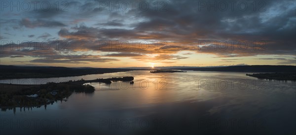 Aerial panorama of western Lake Constance at sunrise with the Mettnau peninsula and the island of Reichenau on the horizon