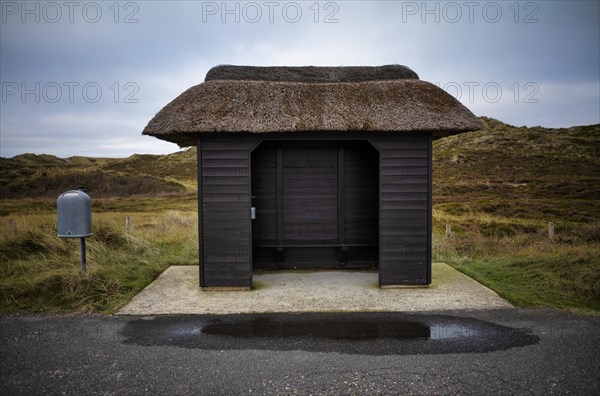 Bus stop with thatched roof