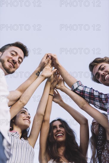 Group friends clapping hands