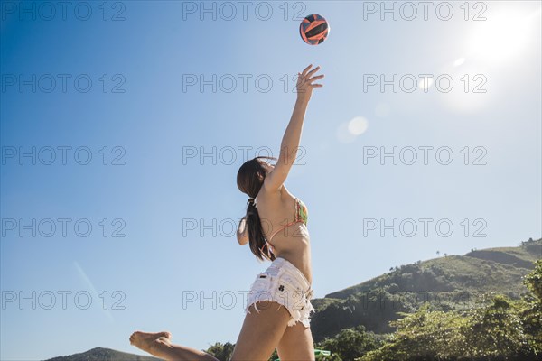 Girl hitting volleyball