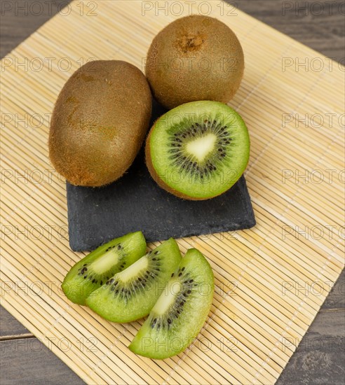 Fresh kiwis sliced on a plate