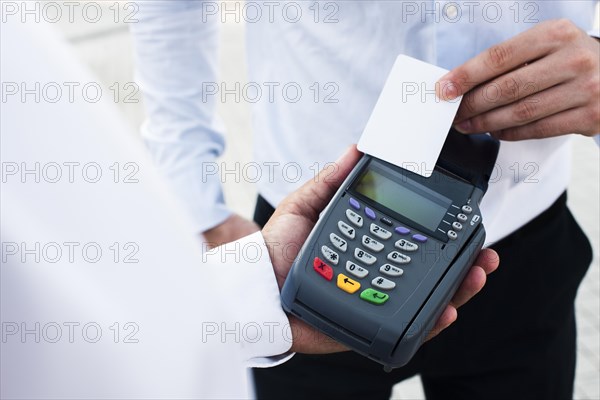 Businessman making payment by card
