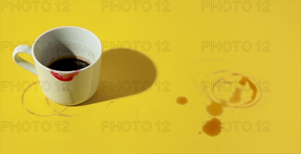 Cup coffee stained with lipstick