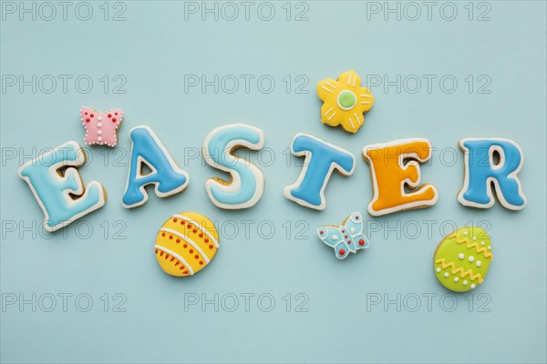 Flat lay easter eggs with flower butterfly shapes