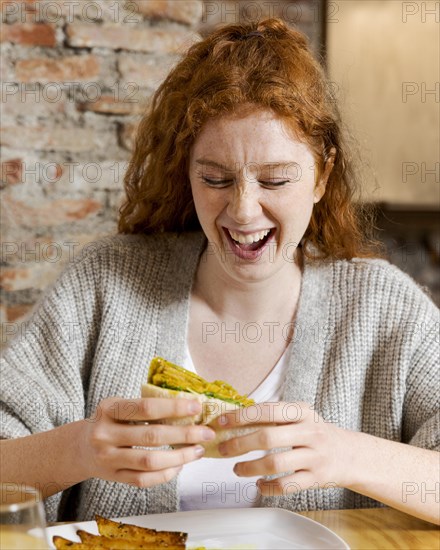 Medium shot happy woman with food