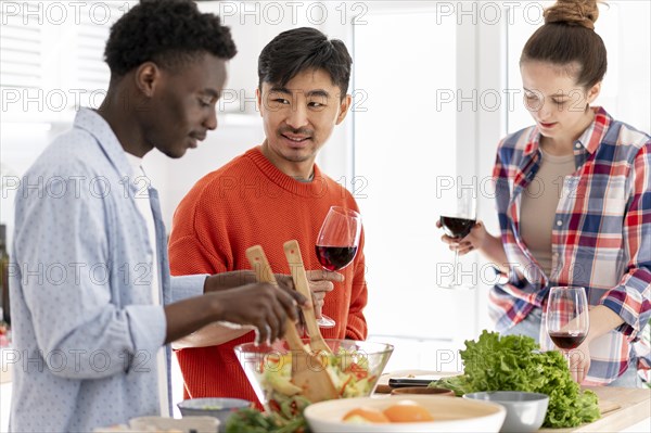 Medium shot friends making food