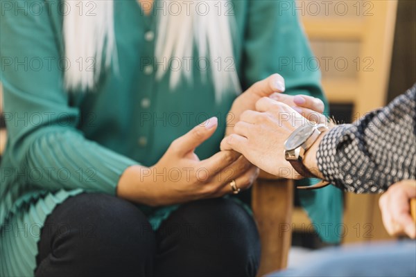 Close up couple holding each other s hand