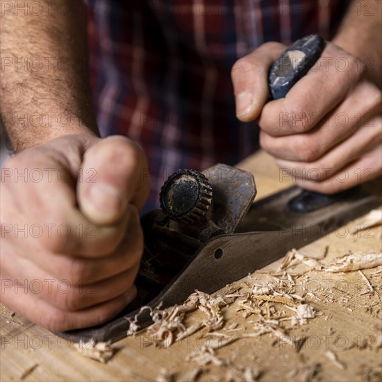 Close up man working with wood 3