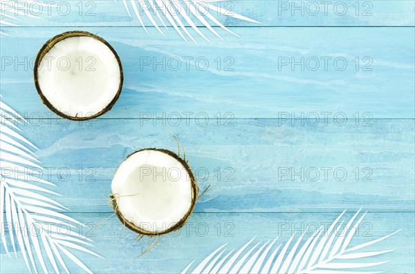 Coconuts with palm leaves wooden table