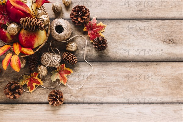 Autumn composition with pine cones clews apples