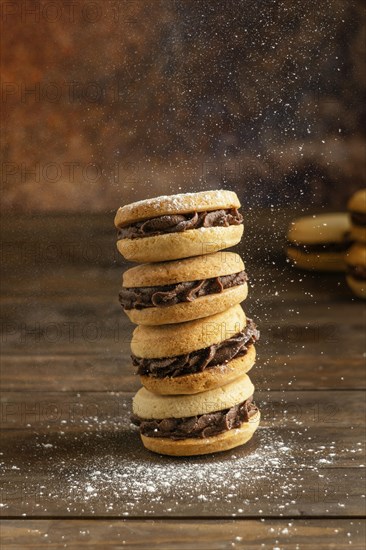 Biscuits with cream wooden table