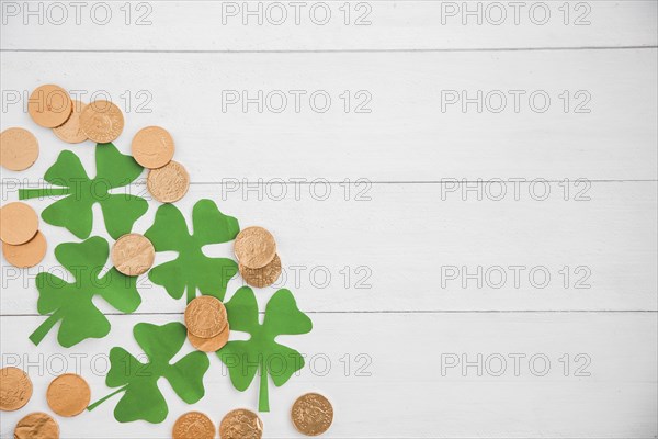 Composition heap coins green paper clovers board