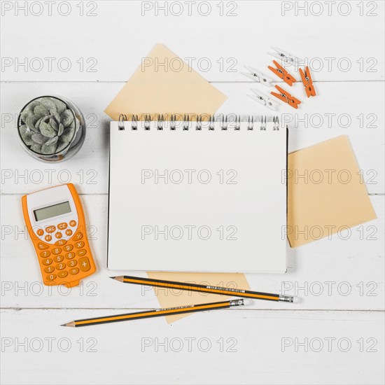 Flat lay notebook mock up surrounded by orange supplies
