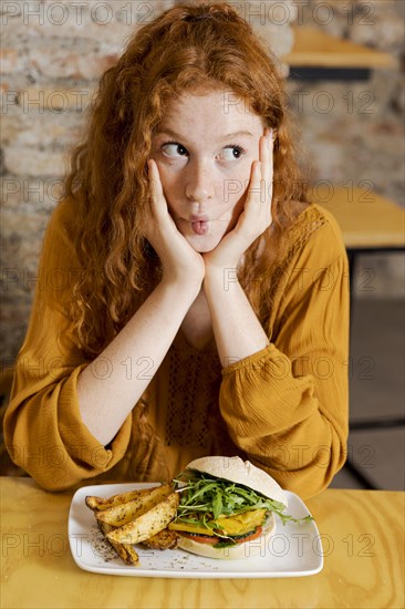 Medium shot woman with delicious food