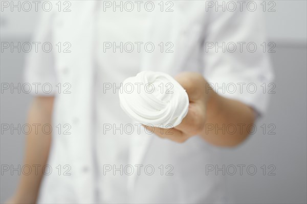 Front view young girl scientist holding slime