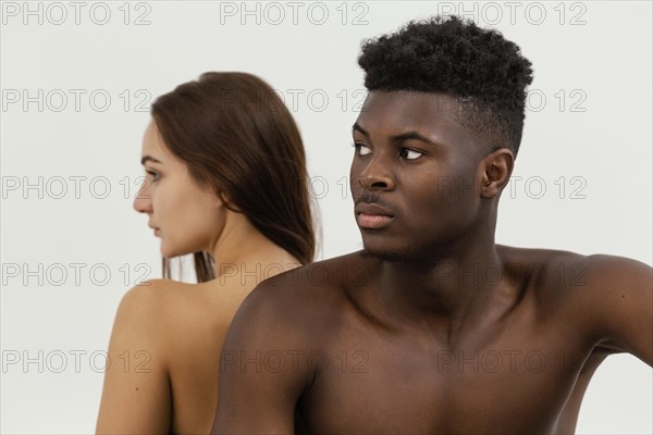 Black man white woman posing together