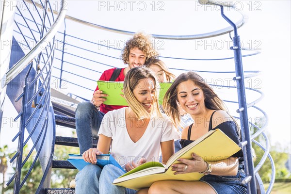 Ladies studying staircase near friends