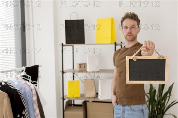 Medium shot man holding frame