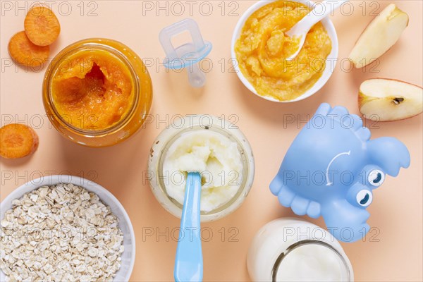 Baby food pink background top view