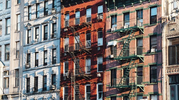 Facades building with fire escapes