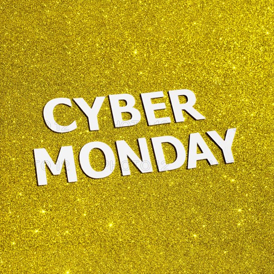 Flat lay golden glitter cyber monday