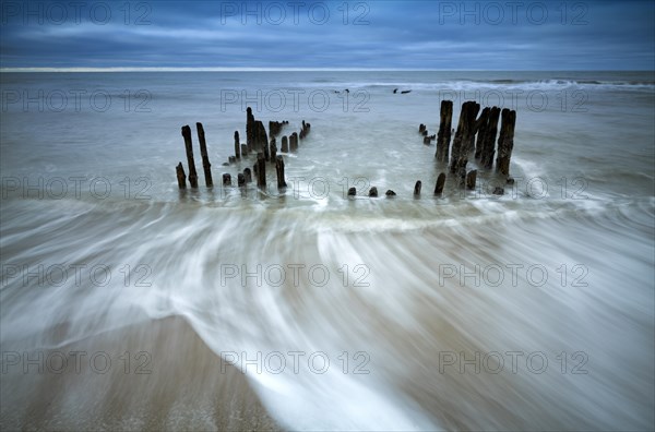 Remains of an old weathered groyne